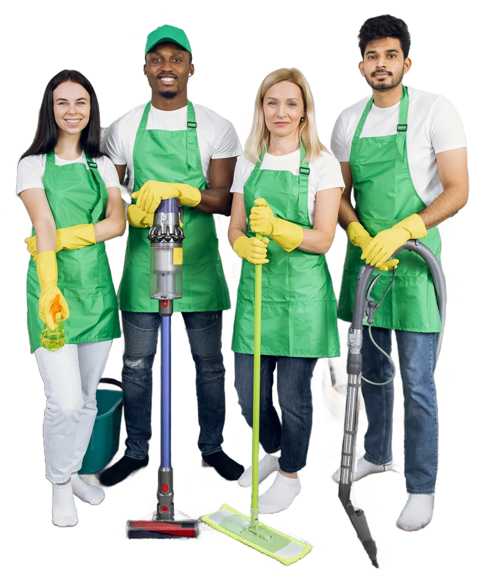 A diverse group of four cleaning professionals stands together, each wearing green aprons and yellow gloves, holding various cleaning tools. They appear friendly and ready to assist with cleaning tasks.